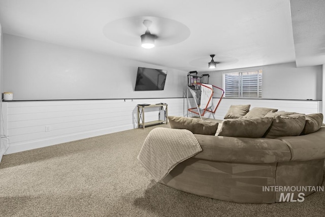 living room featuring ceiling fan and carpet floors