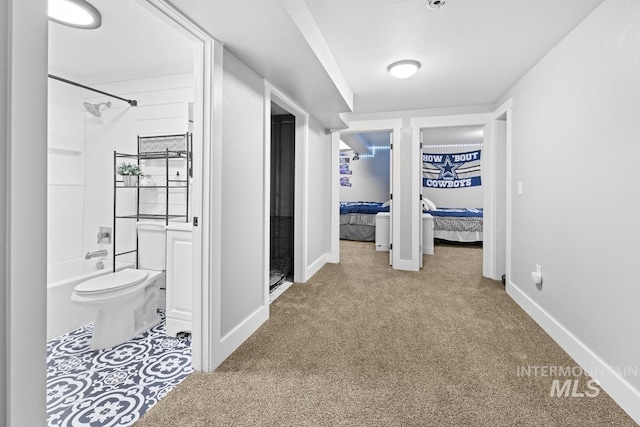 hallway with carpet flooring