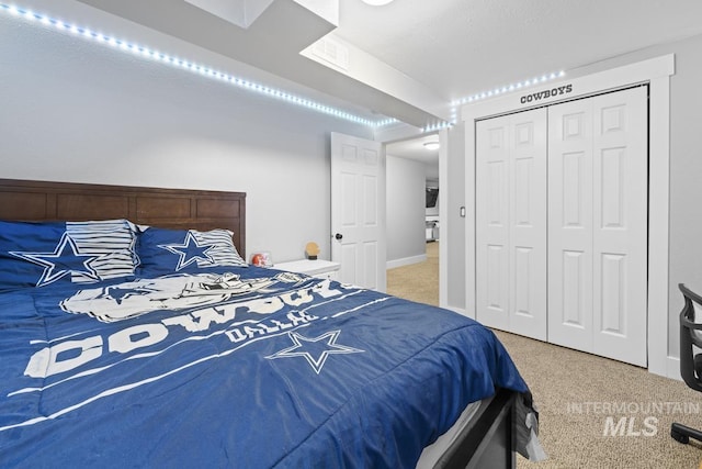 carpeted bedroom featuring a closet