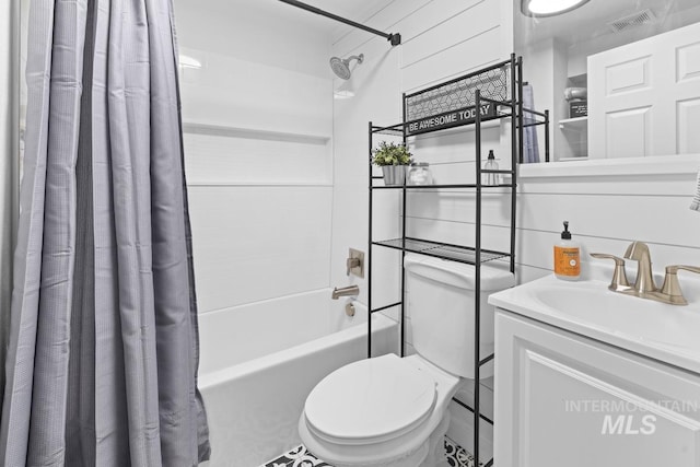 full bathroom featuring vanity, toilet, and shower / tub combo