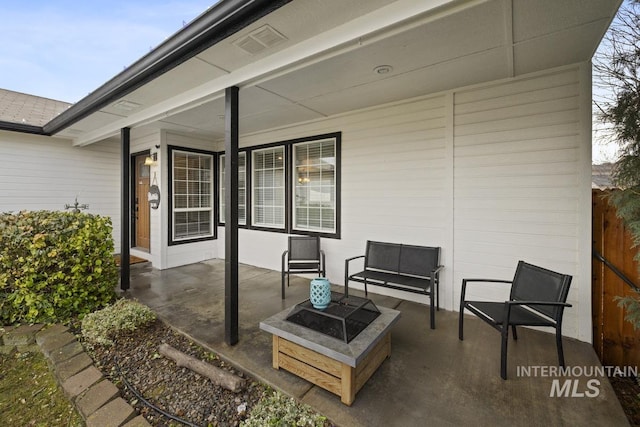 view of patio with an outdoor fire pit