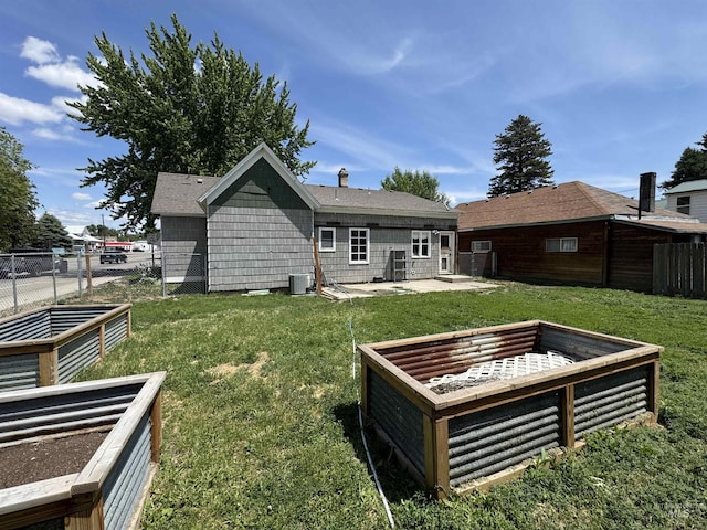 104 E B St, Shoshone, ID 83352 - back of house featuring a garden and a patio area