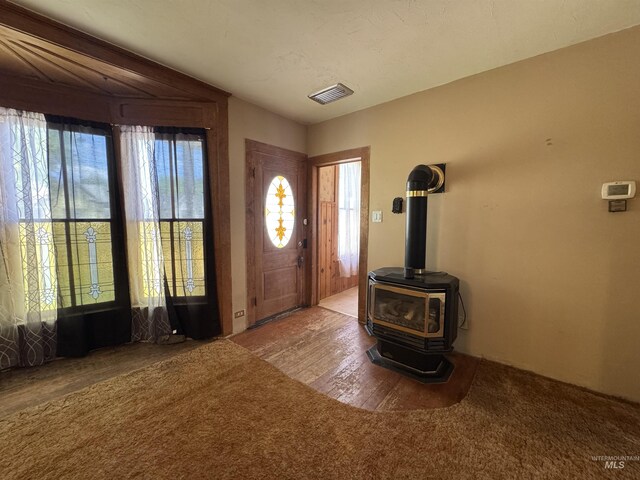 104 E B St, Shoshone, ID 83352 - foyer with a wood stove and wood finished floors
