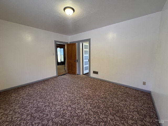 104 E B St, Shoshone, ID 83352 - unfurnished room featuring baseboards and carpet