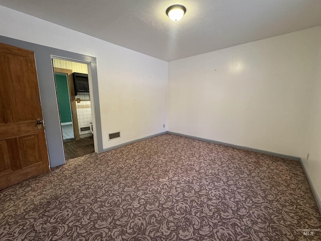 104 E B St, Shoshone, ID 83352 - carpeted spare room with baseboards