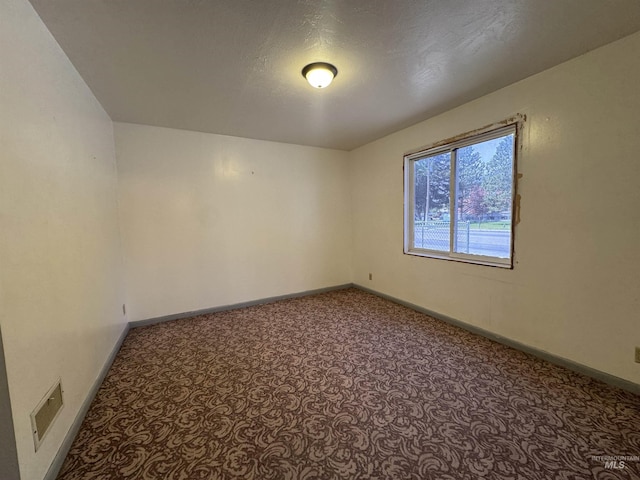104 E B St, Shoshone, ID 83352 - carpeted spare room featuring baseboards