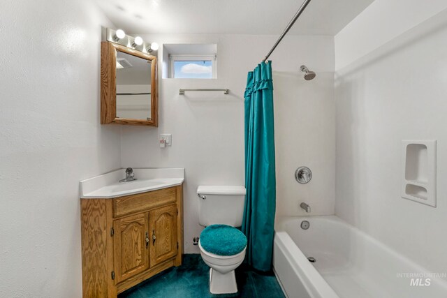 full bathroom featuring vanity, shower / bath combo, and toilet