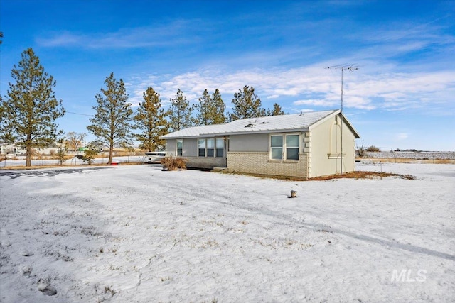 view of snow covered house