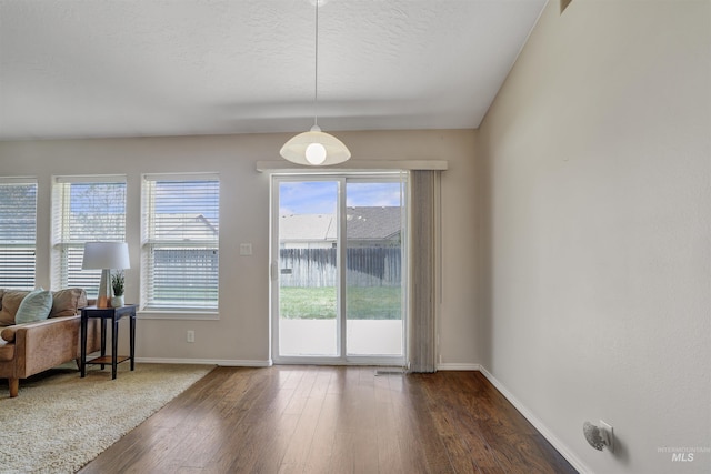 1460 N Pointe Dr, Twin Falls, ID 83301 - doorway with dark wood finished floors and a textured ceiling