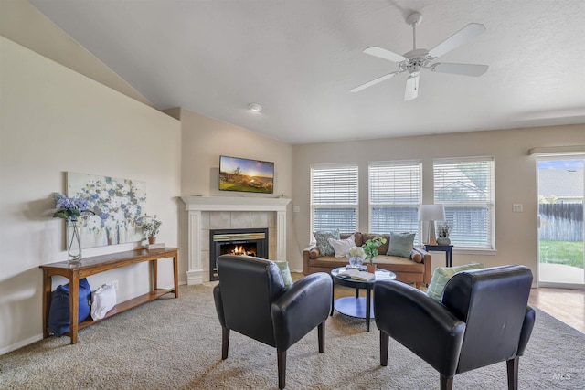 1460 N Pointe Dr, Twin Falls, ID 83301 - living area with carpet, a tile fireplace, a ceiling fan, and vaulted ceiling