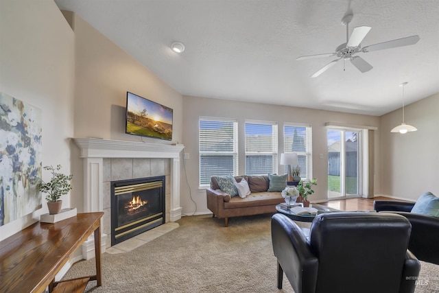 1460 N Pointe Dr, Twin Falls, ID 83301 - living room with light colored carpet, a tiled fireplace, and ceiling fan