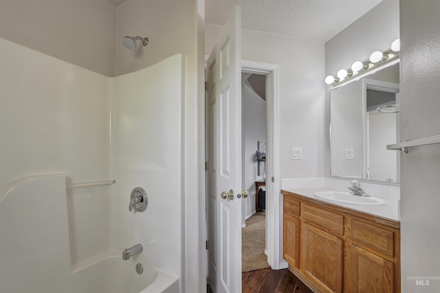 1460 N Pointe Dr, Twin Falls, ID 83301 - full bath with vanity, washtub / shower combination, and wood finished floors
