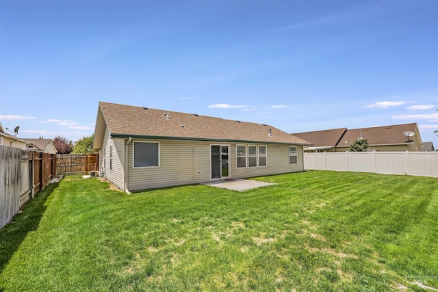 1460 N Pointe Dr, Twin Falls, ID 83301 - rear view of house featuring a fenced backyard, roof with shingles, and a patio area