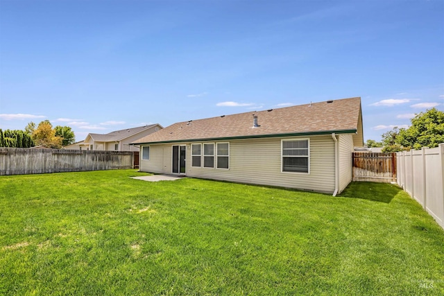 1460 N Pointe Dr, Twin Falls, ID 83301 - rear view of house featuring a fenced backyard, a patio area, and a shingled roof