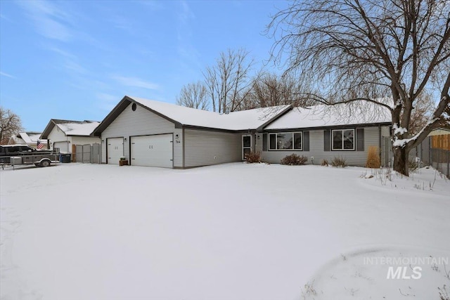 ranch-style house featuring a garage