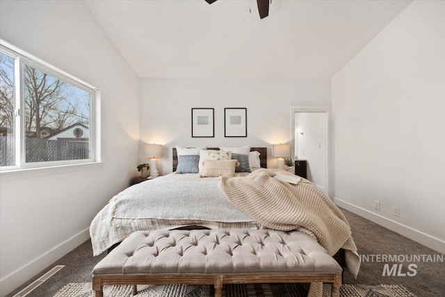 bedroom featuring carpet, vaulted ceiling, and ceiling fan