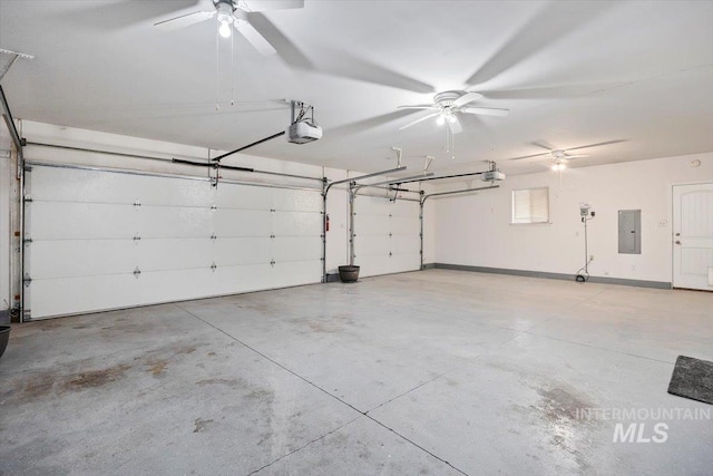 garage featuring electric panel and a garage door opener