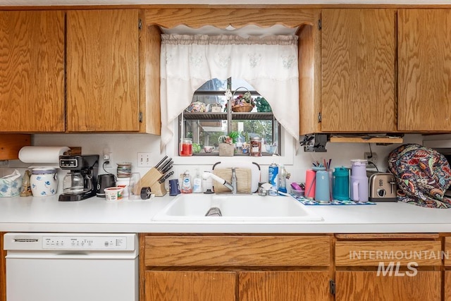 392 S Sun Burst Way, Boise, ID 83709 - kitchen featuring dishwasher, a sink, and light countertops