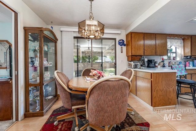 392 S Sun Burst Way, Boise, ID 83709 - dining space with a chandelier and light wood-style flooring