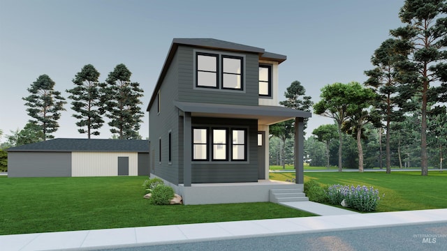 view of front facade with an outbuilding and a front lawn