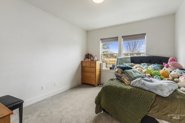 carpeted bedroom with baseboards