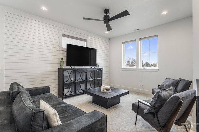 carpeted living room featuring a ceiling fan, recessed lighting, visible vents, and baseboards