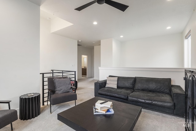 carpeted living area featuring recessed lighting