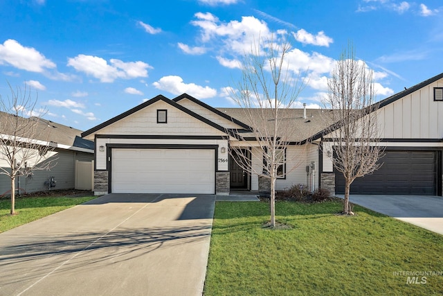 view of front facade with a garage and a front lawn