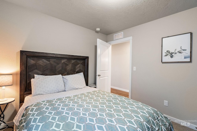 bedroom featuring a textured ceiling