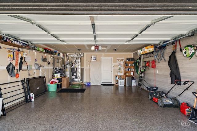 garage featuring a garage door opener and gas water heater