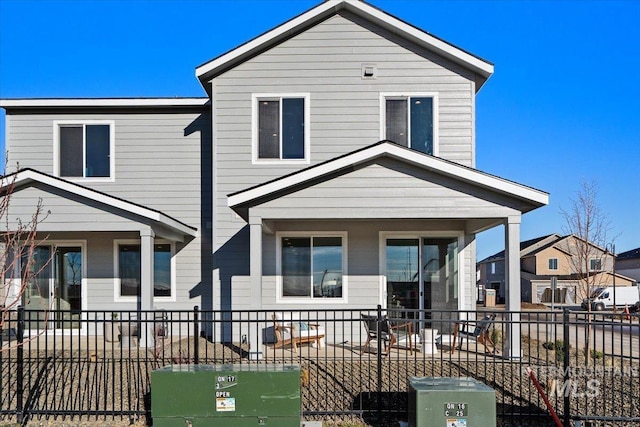 view of front of house with fence