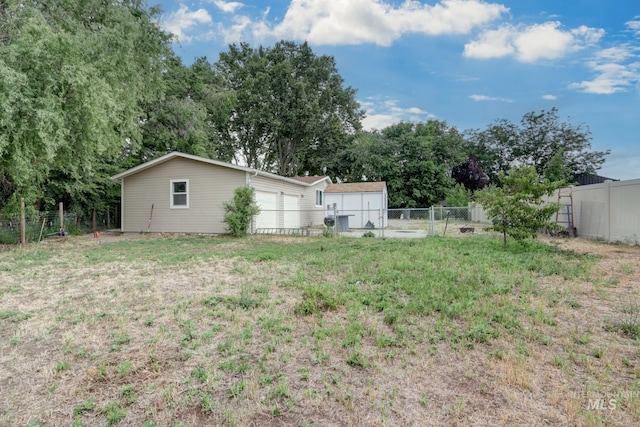 731 W 4th St, Emmett, ID 83617 - view of yard featuring an outdoor structure and view of scattered trees