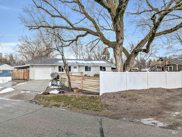 ranch-style house featuring a garage