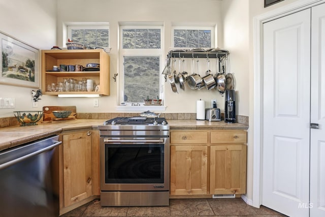 kitchen featuring tile counters and stainless steel appliances