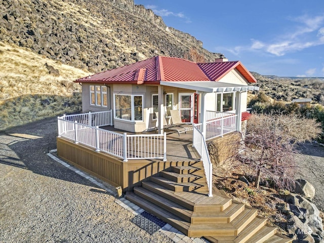 back of house with a mountain view