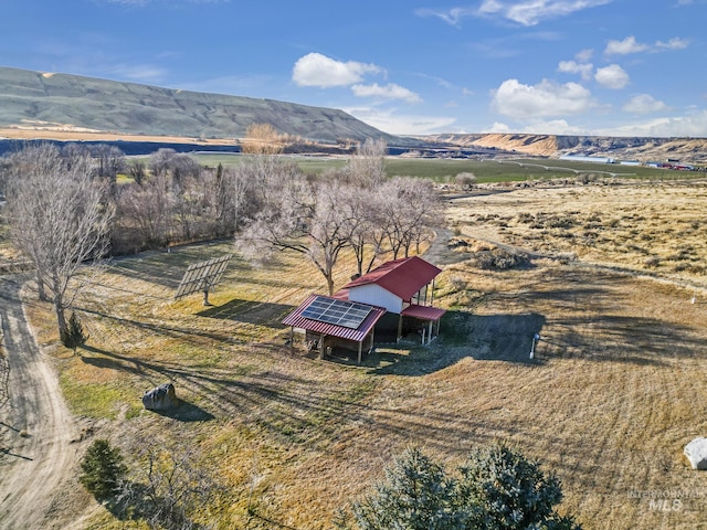 drone / aerial view featuring a rural view and a mountain view