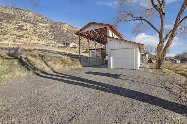 view of side of property with a mountain view