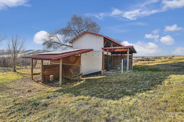 exterior space with a rural view and a yard