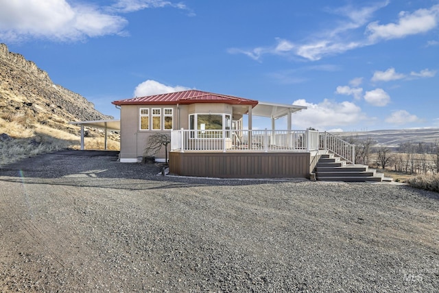 back of house featuring a mountain view