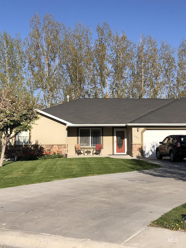 ranch-style house with an attached garage, concrete driveway, stucco siding, and a front lawn