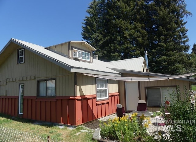 view of property exterior with metal roof