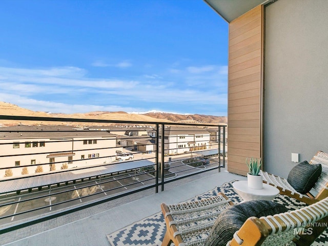 balcony featuring a mountain view