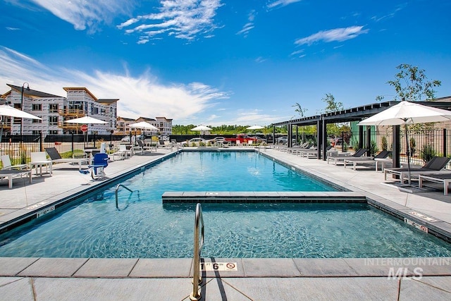 view of swimming pool with a patio