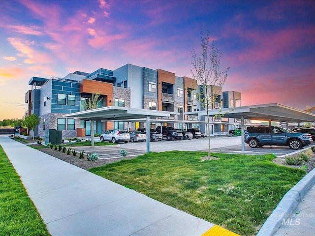 view of outdoor building at dusk