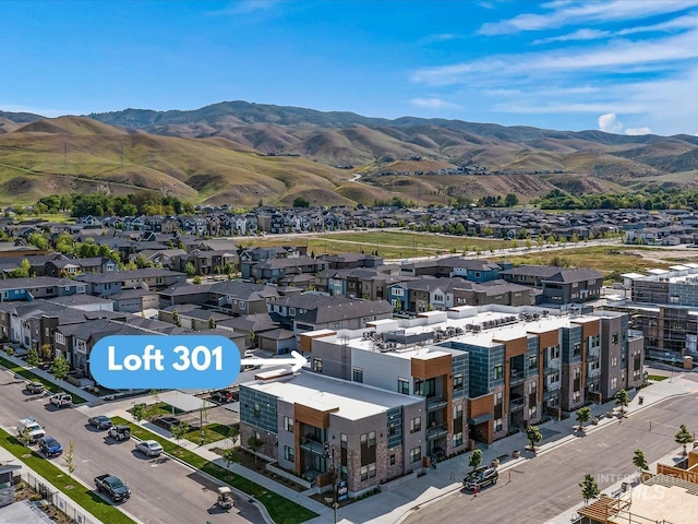 birds eye view of property with a mountain view