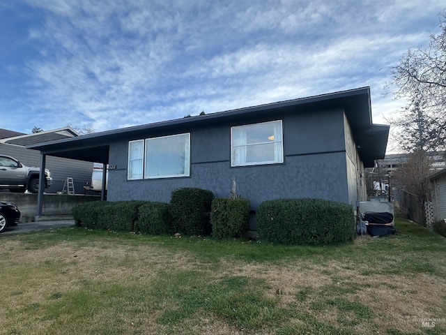 view of home's exterior with a yard