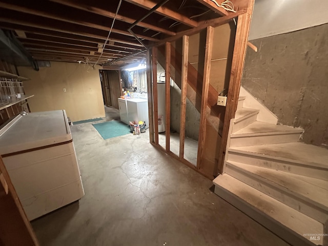 basement with washing machine and clothes dryer