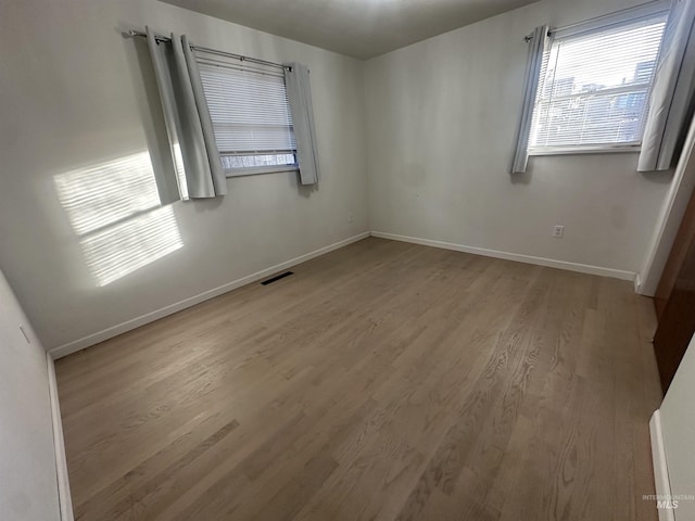 empty room featuring hardwood / wood-style floors