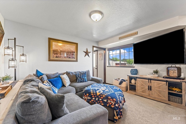 living area featuring a textured ceiling and light colored carpet