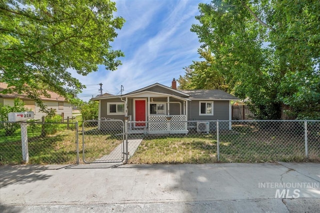 216 9th Ave N, Nampa, ID 83687 - view of front of home featuring covered porch, a chimney, and a gate